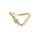 Gold ring with small station set diamonds and on a white background.