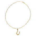 A 14k gold necklace with a horseshoe pendant on a white background.