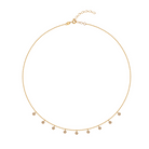 Gold necklace with small bezel set diamond pendants on a white background