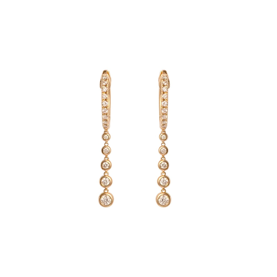 Gold hoop earrings with small diamonds on a white background.