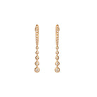 Gold hoop earrings with small diamonds on a white background.