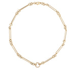 A 14k gold necklace with a double-sided diamond enhancer, featuring oval and round link chains.