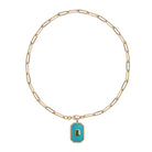 A paperclip chain with a turquoise pendant.