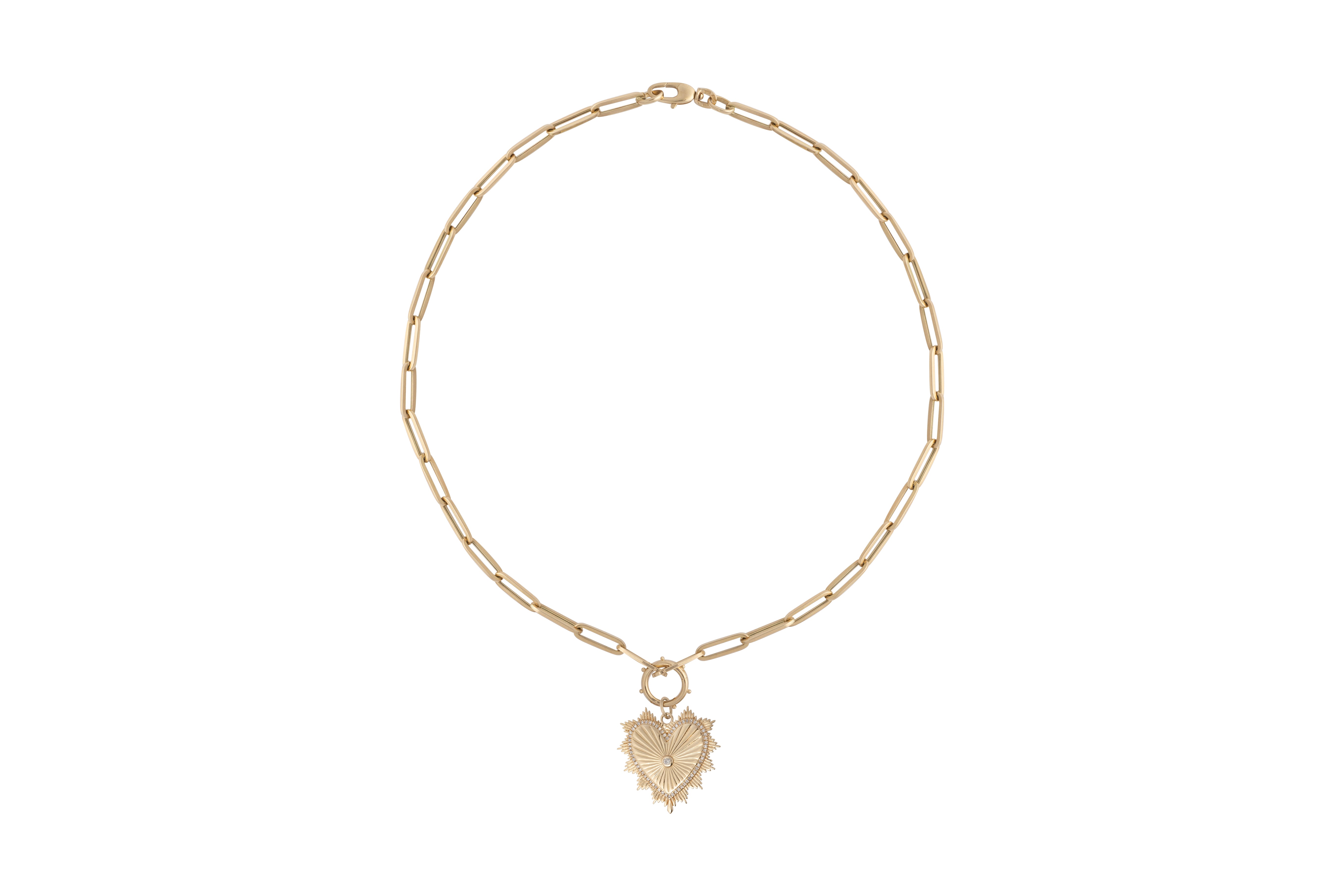 A gold paperclip chain with a round pendant bail and a beveled-edge heart pendant.