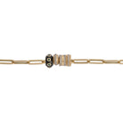 A close-up image of a 14k gold paperclip chain necklace with diamond and emerald roundel beads.