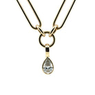 A close-up of a pear lab grown diamond pendant, set in 14k gold on a chunk chain all on a white background. 