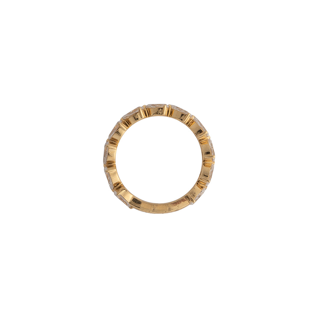 A sideways view of a ring showcasing the 14k gold setting, set on a white background. 