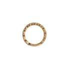 A sideways view of a ring showcasing the 14k gold setting, set on a white background. 