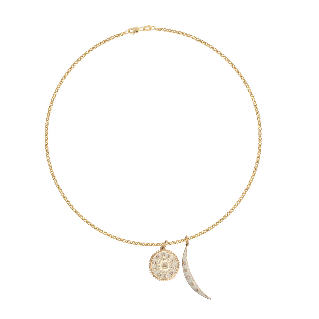A white background featuring a thin gold rolo chain with two white enamel pendants. 