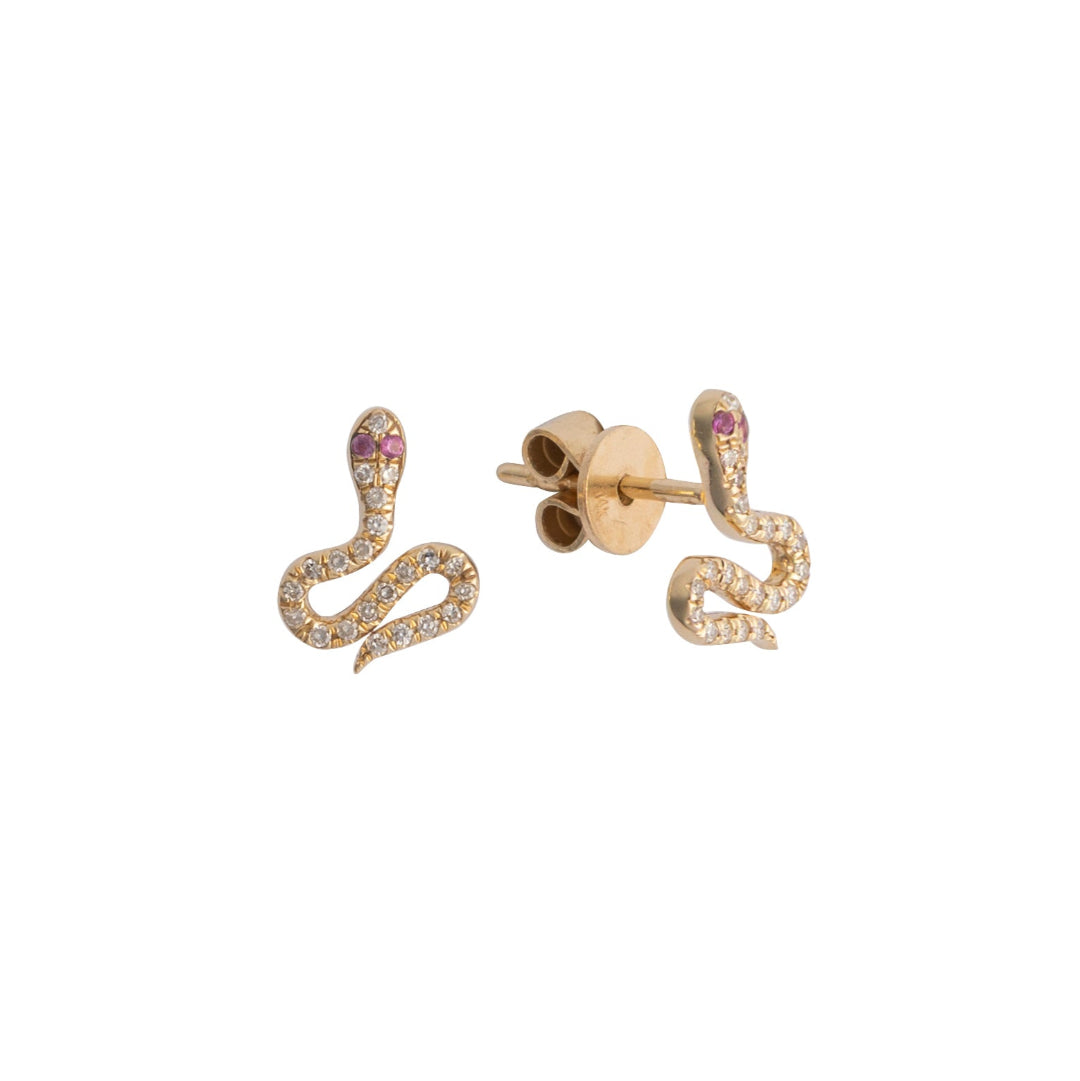 Gold snake-shaped earrings with diamond pavé and pink sapphire eyes  on a white background