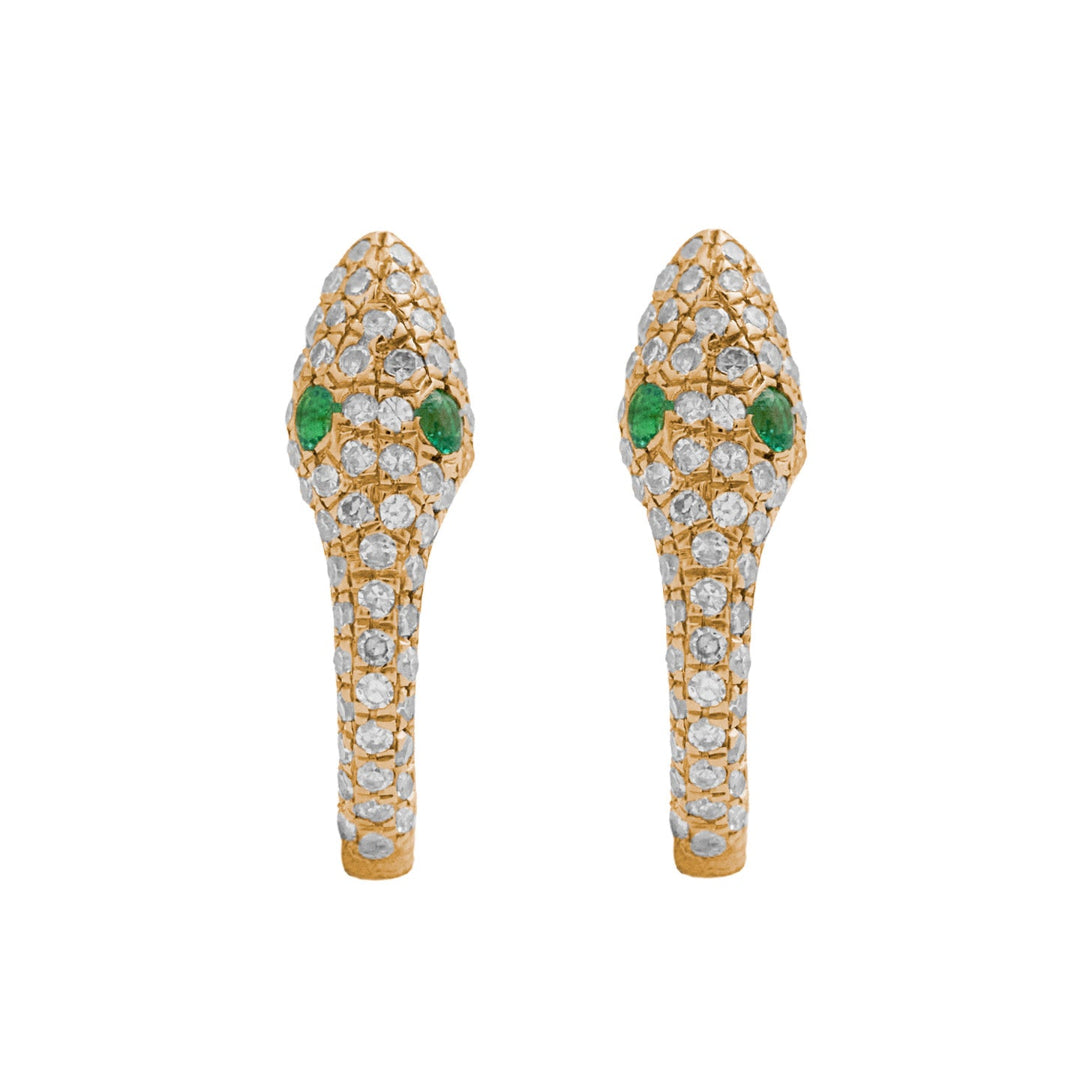 A pair of gold serpent-shaped huggie earrings adorned with natural diamonds and emeralds. 