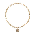 A white background with a  a chunky u-link 14k gold necklace layered a diamond serpent pendant attached.