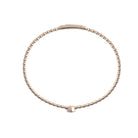 A white gold bangle on a white background