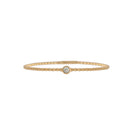 Gold bracelet with a single station diamond on a white background