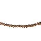 A delicate beaded necklace made of small, faceted snoky quartz beads, arranged in an oval shape on a plain white background.