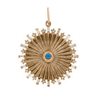 A 14k gold pendant featuring a geometric sunray pattern with a central turquoise stone and sparkling diamonds.
