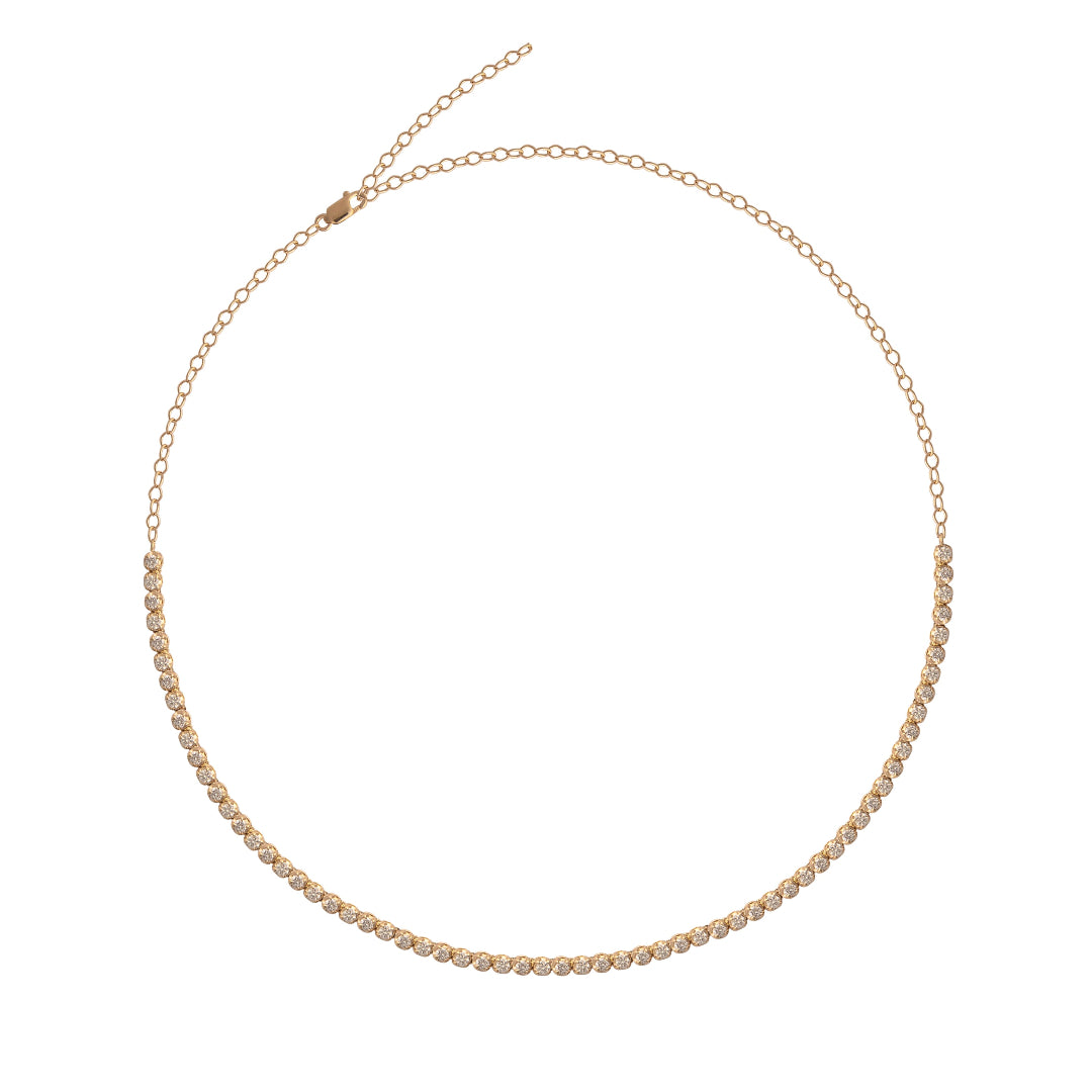 Gold tennis necklace on a white background