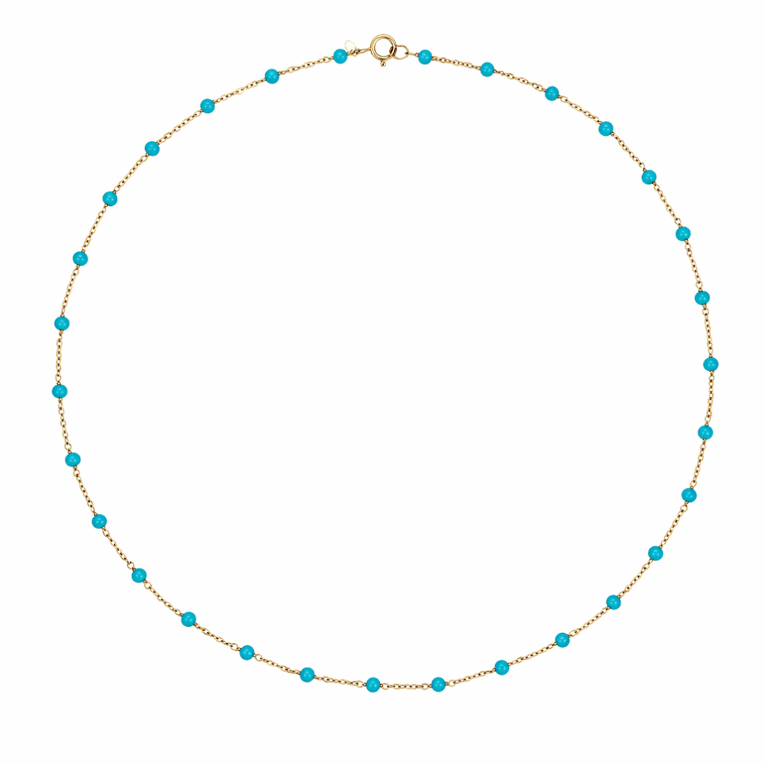 14k gold necklace with turquoise beads on a white background.