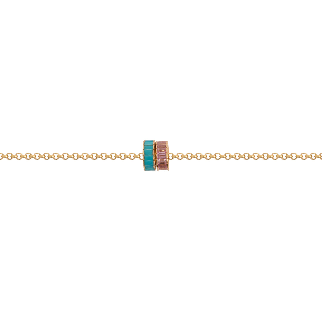 Gold necklace with gemstone beads on a white background.