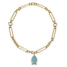 A chunky 14k gold chain necklace with a turquoise fish pendant on a white background.