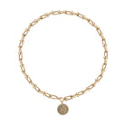 A chunky gold necklace with a diamond serpent pendant. 