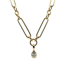 A close-up of a pear lab grown diamond pendant, set in 14k gold on a chunk chain all on a white background. 