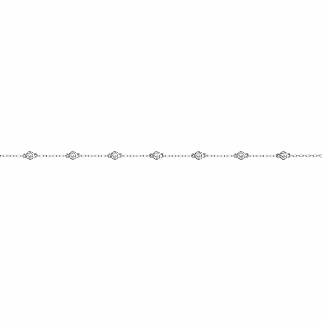 White gold chain bracelet with small round diamonds on a white background