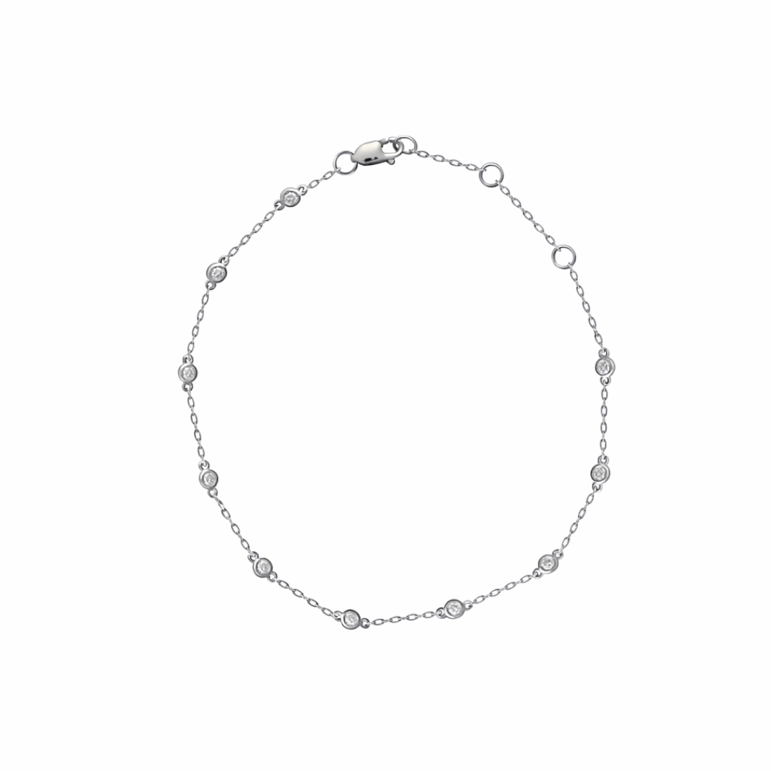 White gold bracelet with small station diamonds on a white background