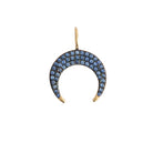Crescent moon-shaped pendant with blue sapphires on a white background