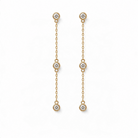 14k yellow gold diamond station drop earrings on a white background. 
