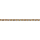 A close up of an emerald shaped tennis bracelet with an east-west orientation, set in 14k gold. 