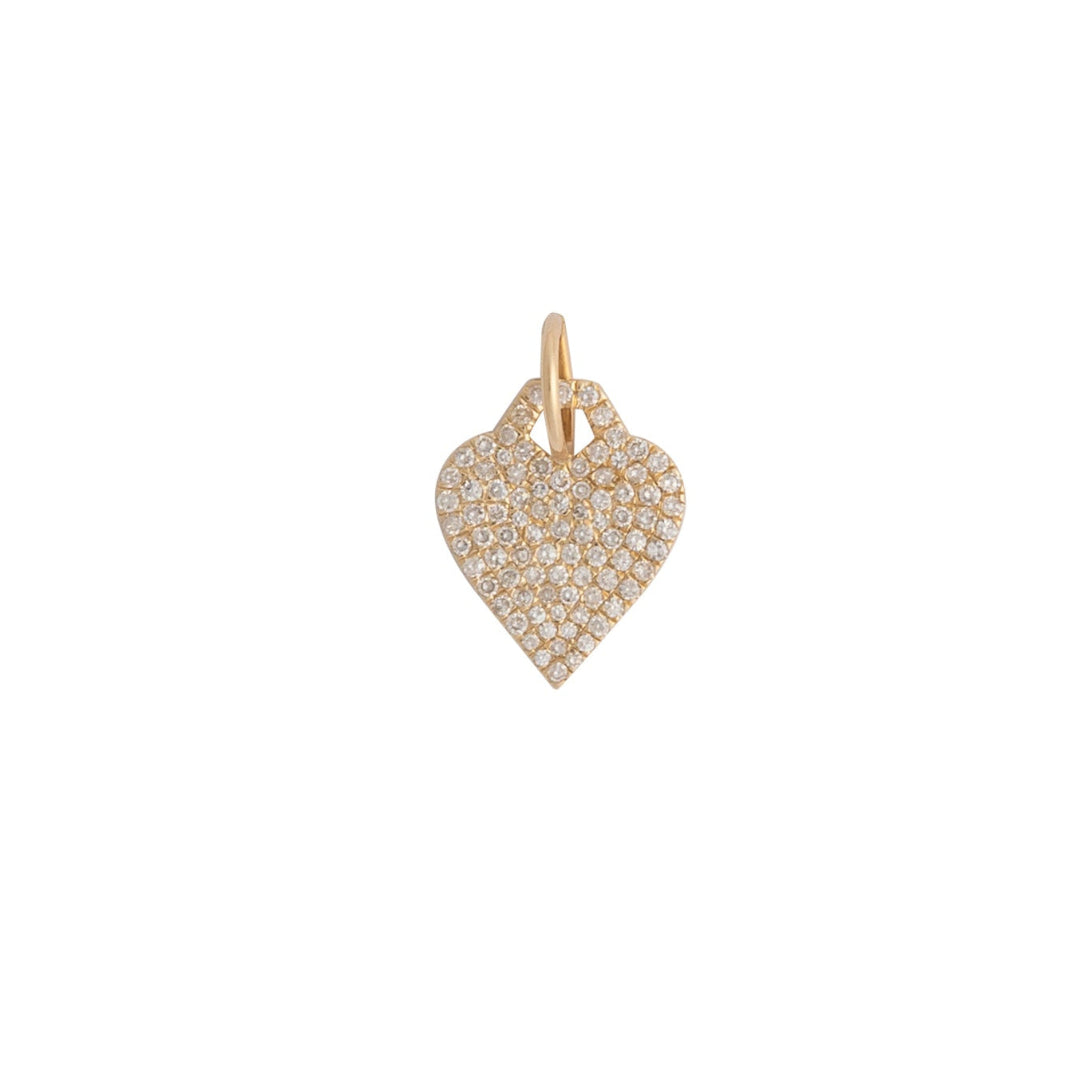 Heart-shaped gold pendant with embedded stones on a white background