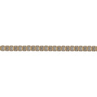A close up of a lab-grown diamond tennis bracelet with emerald shaped diamonds in a north-south orientation. Bezel set in 14k gold against a white background. 