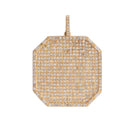 Gold and pave diamond pendant on a white background